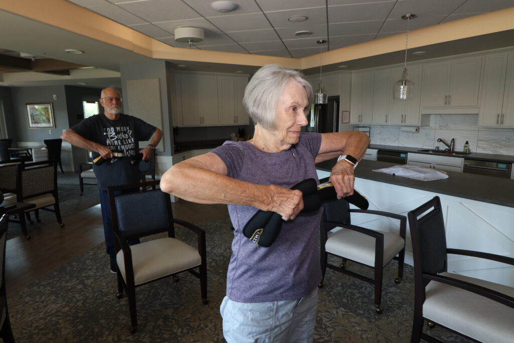 senior citizen lifting weights